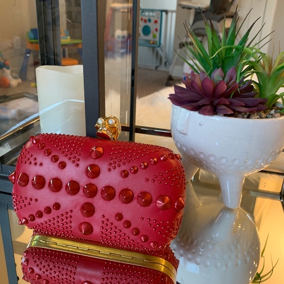 Alexander McQueen Handbags - Alexander McQueen
Spike Red Leather Clutch